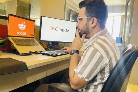 Vicky Lalwani researching community and social channels at his desk